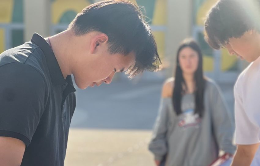 photo of ASB student at podium or leading a club meetin