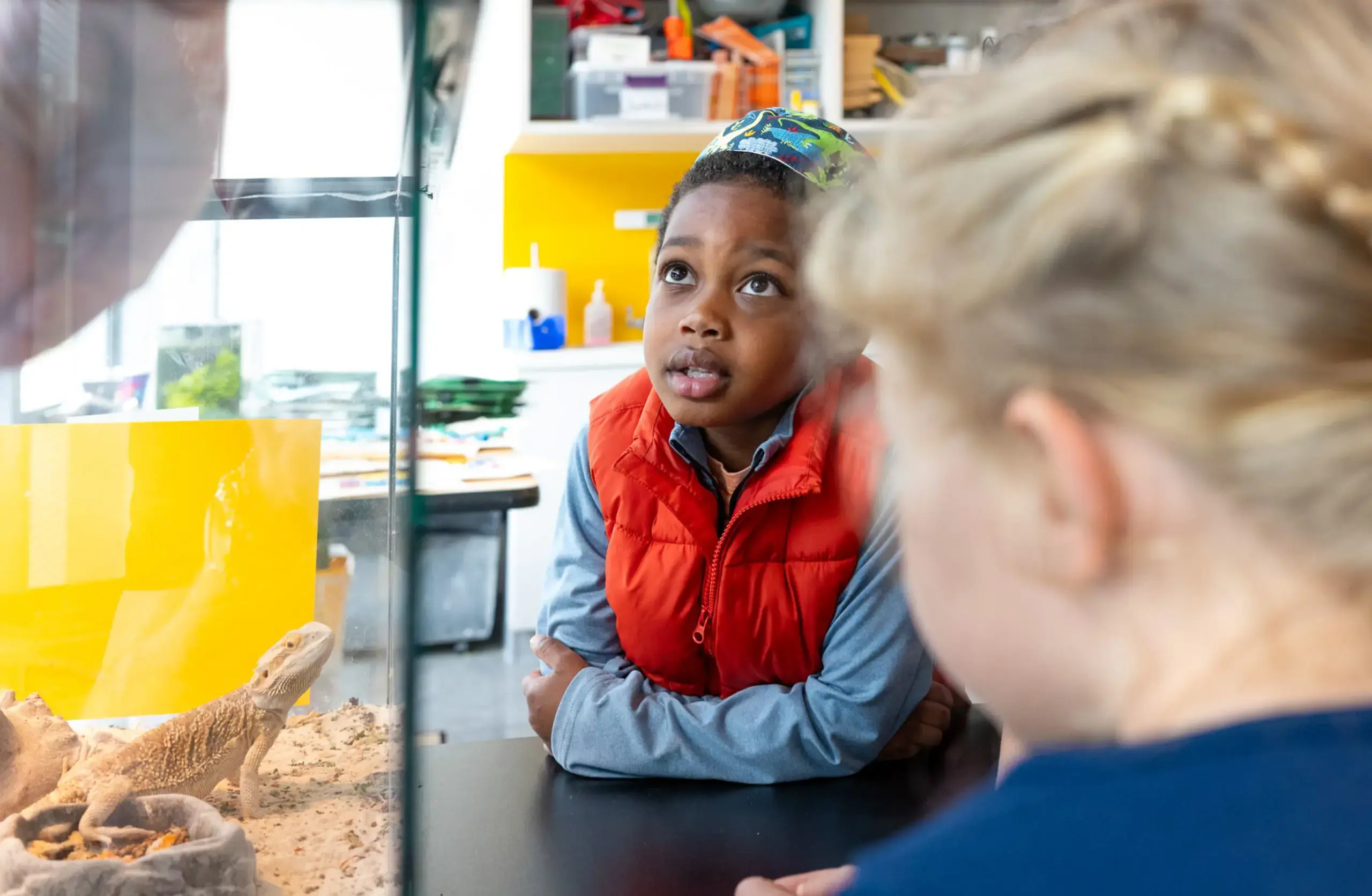 Student in STEM classrom, looking upwards