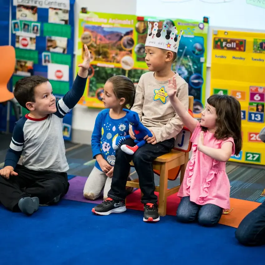 Young students sitting on mat