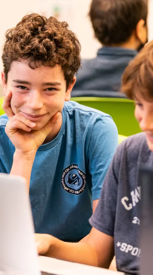Student in science lesson, smiling for camera