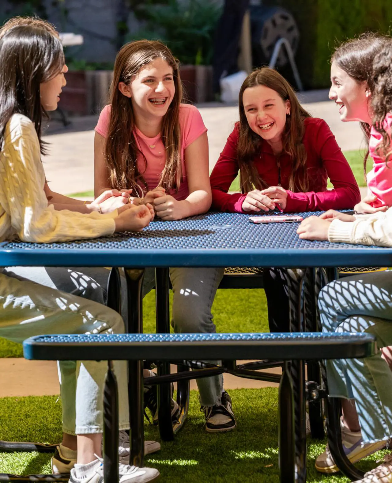 Students sitting at picnic table