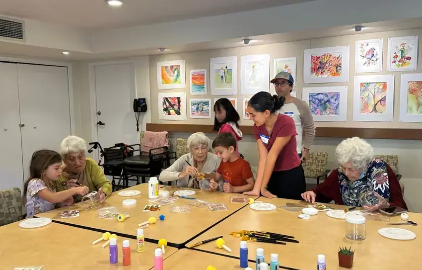 photo of middle school students teaching/guiding Lower School students