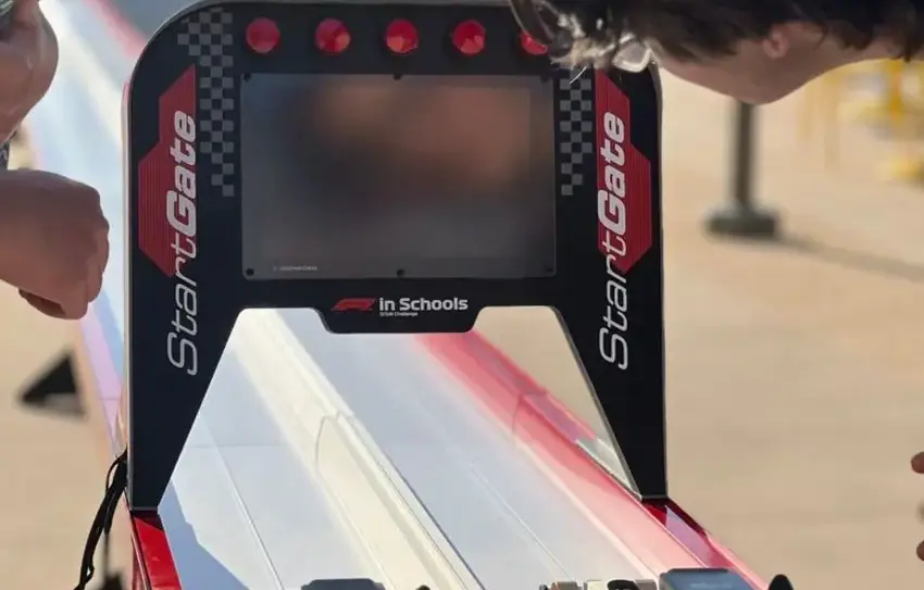 photography of Middle School VEX or STEM Racing team meeting/testing out a model